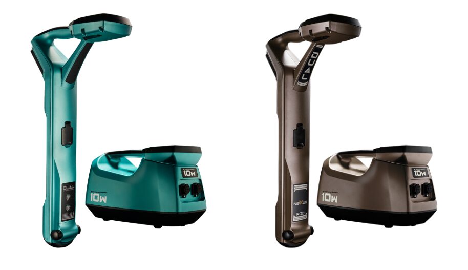 Two cordless garment steamers in teal and bronze with charging bases.