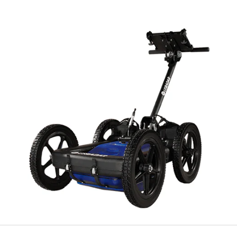 All-terrain four-wheeled cart with a tall handle and blue battery pack, designed to be pushed or towed.